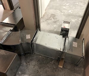 air conditioning ducting laying on the floor