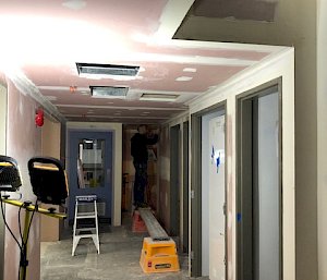 looking down unpainted corridor