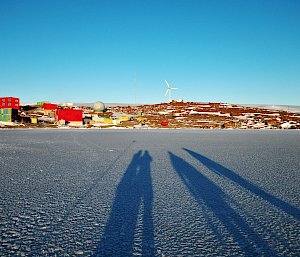 Shadows of expeditioners on the snow