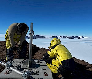 Two expeditioners repairing a communications tower