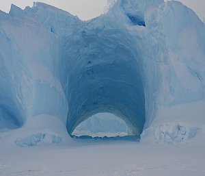 iceberg with tunnel through the middle