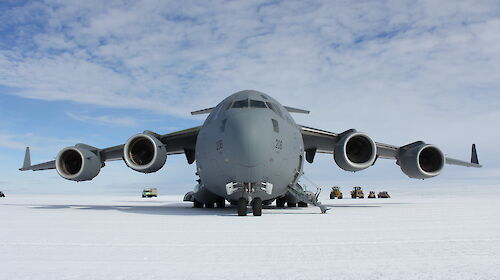 Front-on view of a large Air Force aircraft on an ice runway in Antarctica.