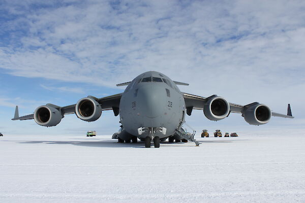 Front-on view of a large Air Force aircraft on an ice runway in Antarctica.