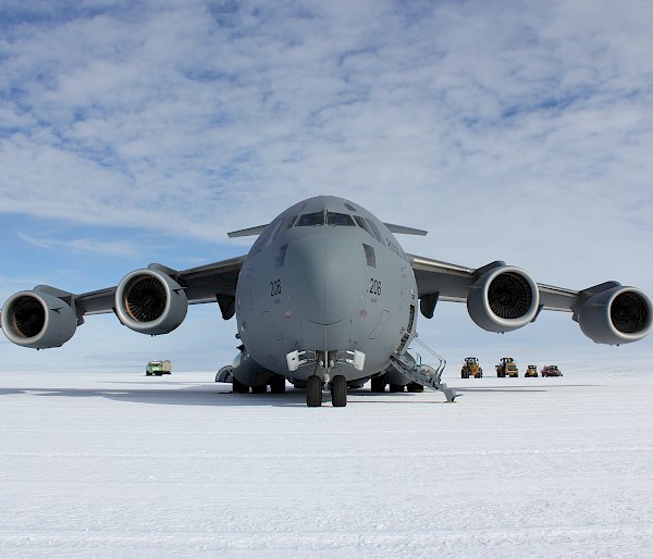 Front-on view of a large Air Force aircraft on an ice runway in Antarctica.