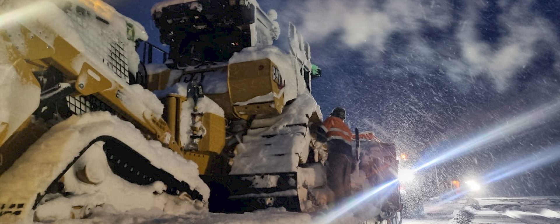 Dozer operating while it is snowing