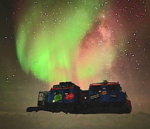 aurora in background with machine in front