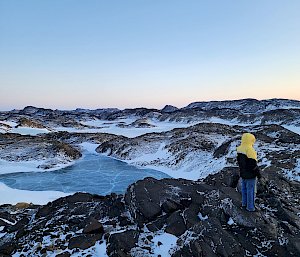 man standing on hill in Antarctica