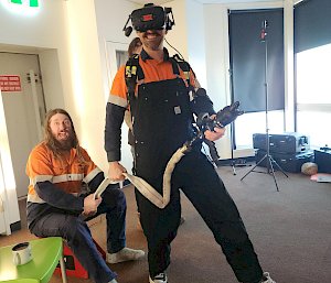 Two expeditioners doing virtual reality firefighting