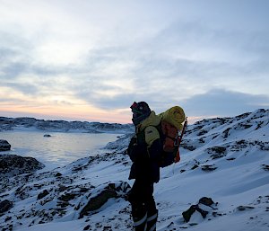 person standing on hill