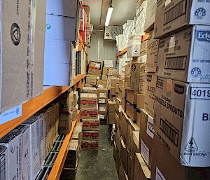 Cardboard boxes stacked on shelvers