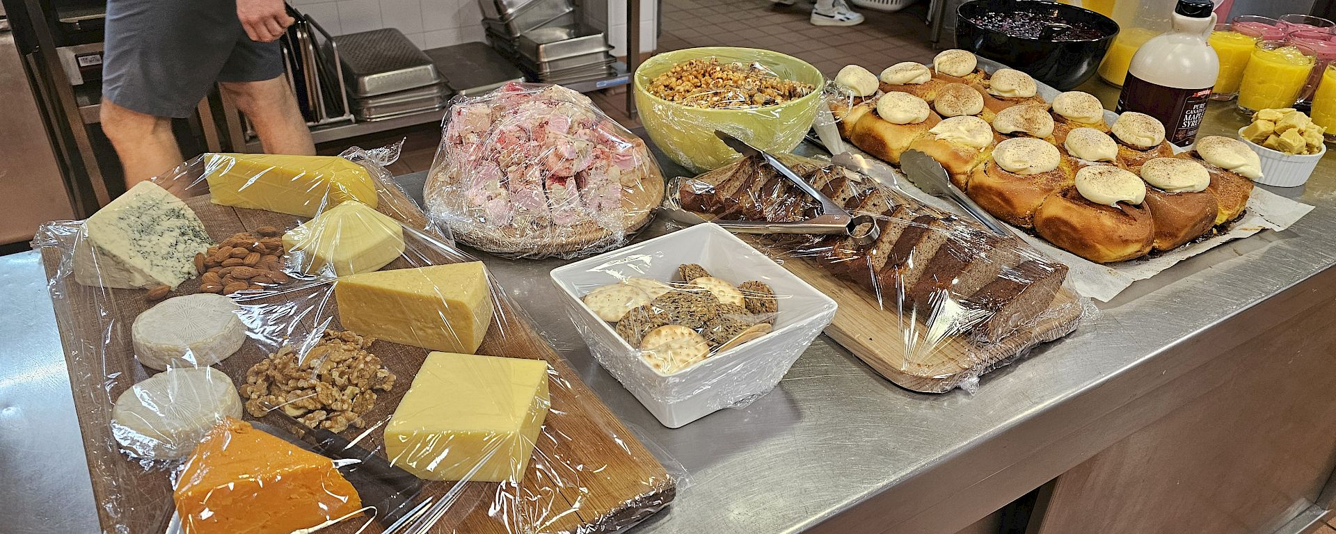 Cheese boards and other foods on trays and in bowls