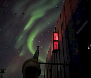 aurora with building in foreground