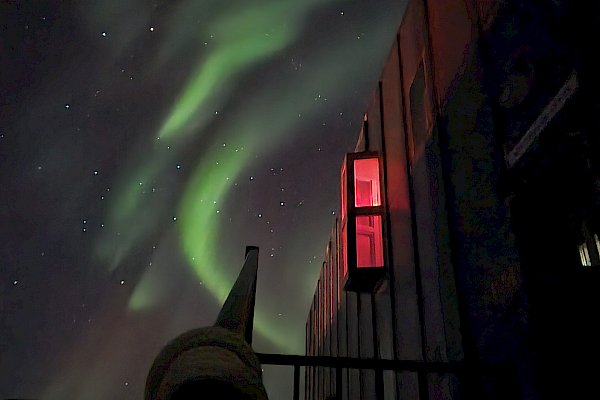 aurora with building in foreground