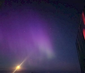 aurora with building in foreground