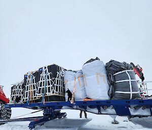 Packaged cargo on a sled.