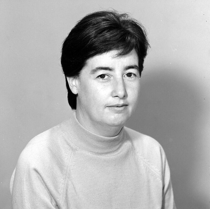 Black and white portrait of a woman with short black hair.