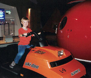 boy sitting on skidoo