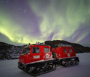 Hagglund tracked vehicle with a green aurora overhead