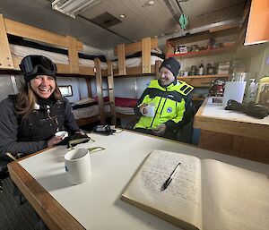 people sitting around table smiling