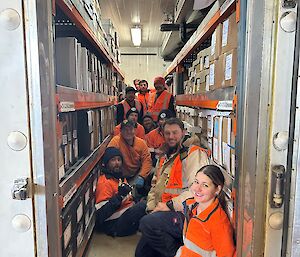 A group of people in hi vis inwside a pantry