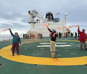 Three people set off flares on the helideck on RSV Nuyina