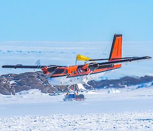A Twin Otter comes in to land on the skiway at Mawson station.
