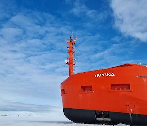 The bow or a red ship parked up in the ice