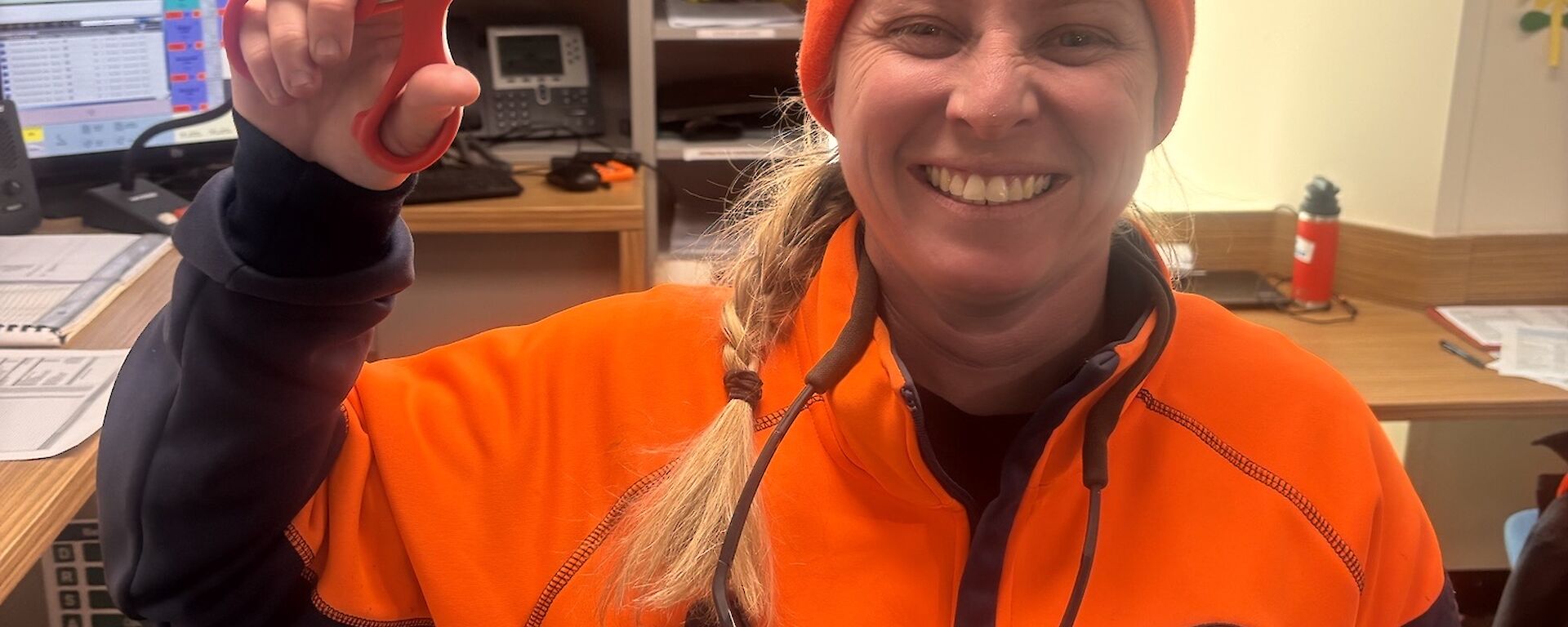 SSUP Cliffy (foreground) holds the trauma scissors with a cheeky grin as she stands in the lower wallow (background)