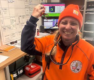 Cliffy stands (foreground) holding the prized scissors, the lower lounge in the background