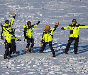 Image of 5 expeditioners standing on snow.