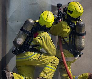 Image of two expeditioners conducting fire training.