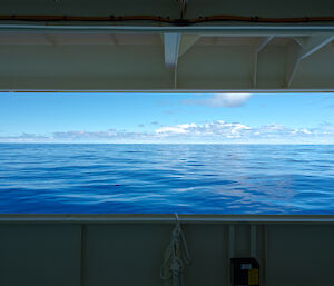Glassy sea and blue skies