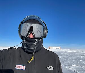 A man in goggles and full outdoor gear