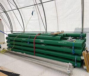 A pile of green pipes
