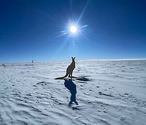 A cutout of a kangaroo on a white snowy plain