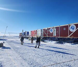 A group of people playing volleyball on the snow