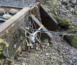 A close-up of pipework and sensors on the small wall of the Gadgets Gully Dam