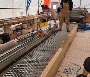 A length of metal mesh protecting cables underneath.