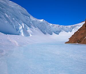 A wind-scoured, icy landscape.