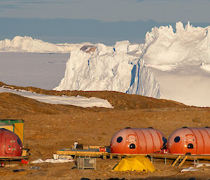A very craggy iceberg, reminiscent of a castle is in the background behind Law Base camp