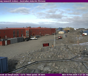 A photo of a large red building with a black sign in front that has been edited to say "have we cheated"
