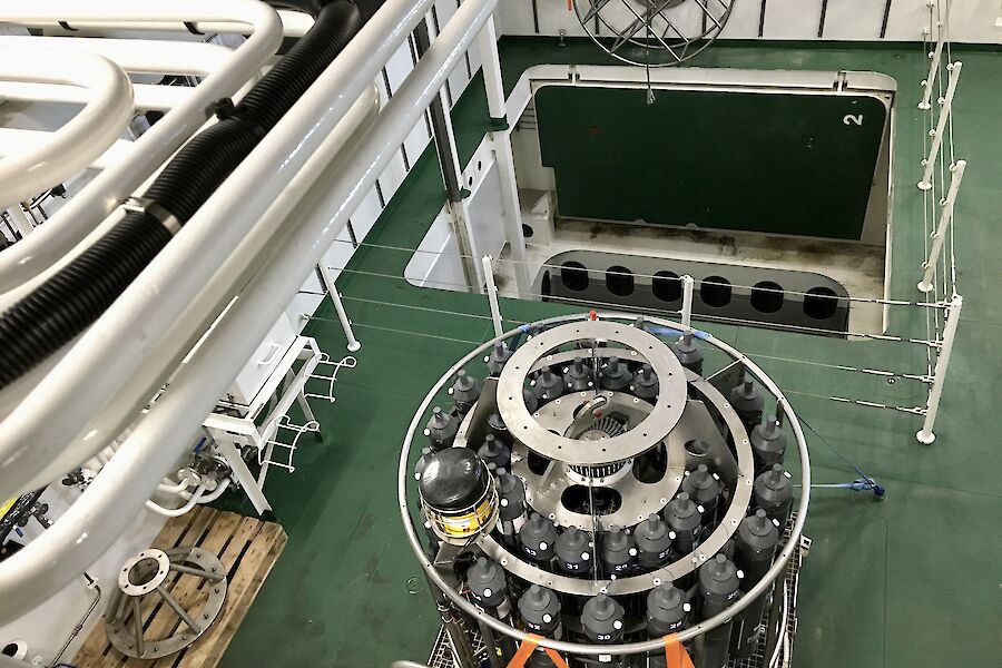 Looking down on to the deck of a ship that contains a CTD instrument and square moon pool