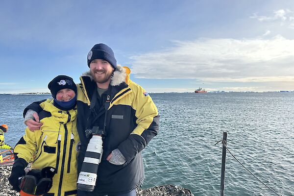 Two Antarctic expeditioners outside at Davis research station.